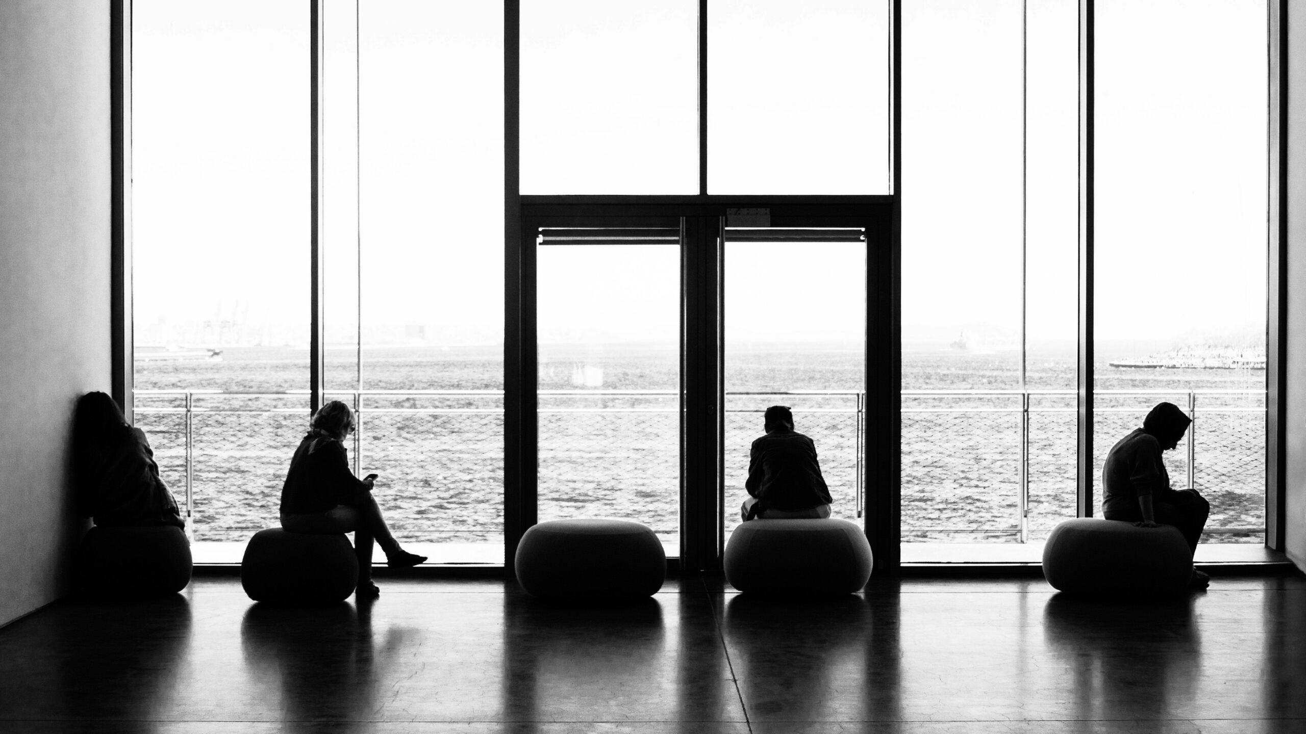 Calm interior scene overlooking the ocean, supporting the reflective tone of the About Dr Kerri Thomas page